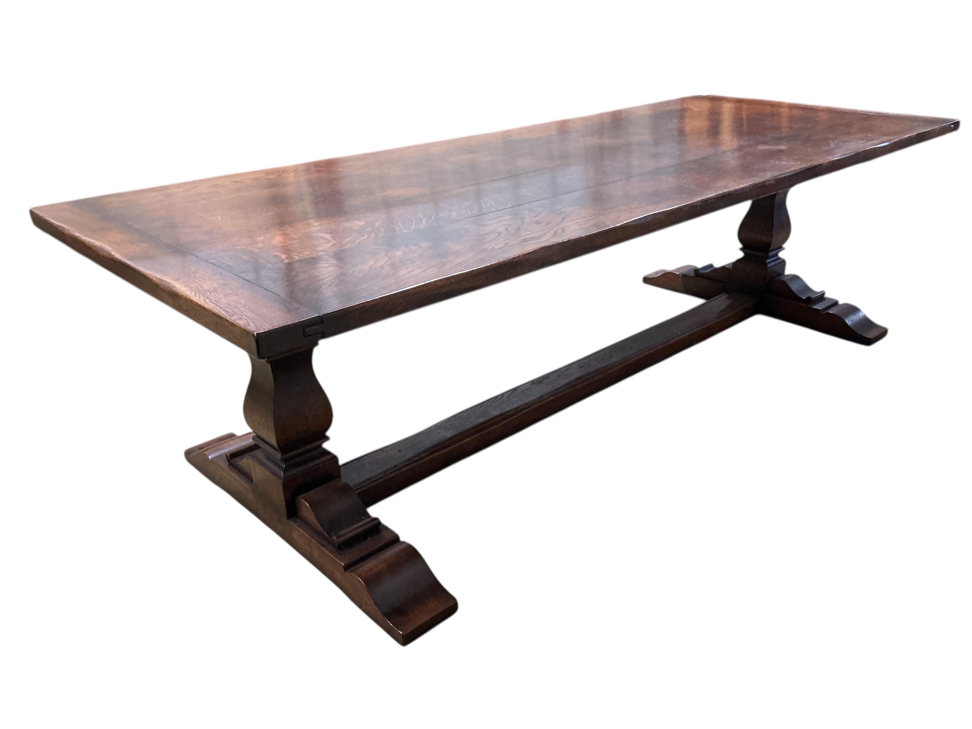 An 18th century style rectangular oak refectory dining table, width 274cm, depth 108cm, height 77cm
